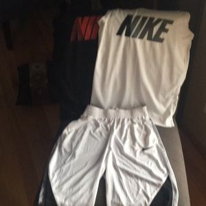 2 Nike muscle shirts and pair of Nike shorts.